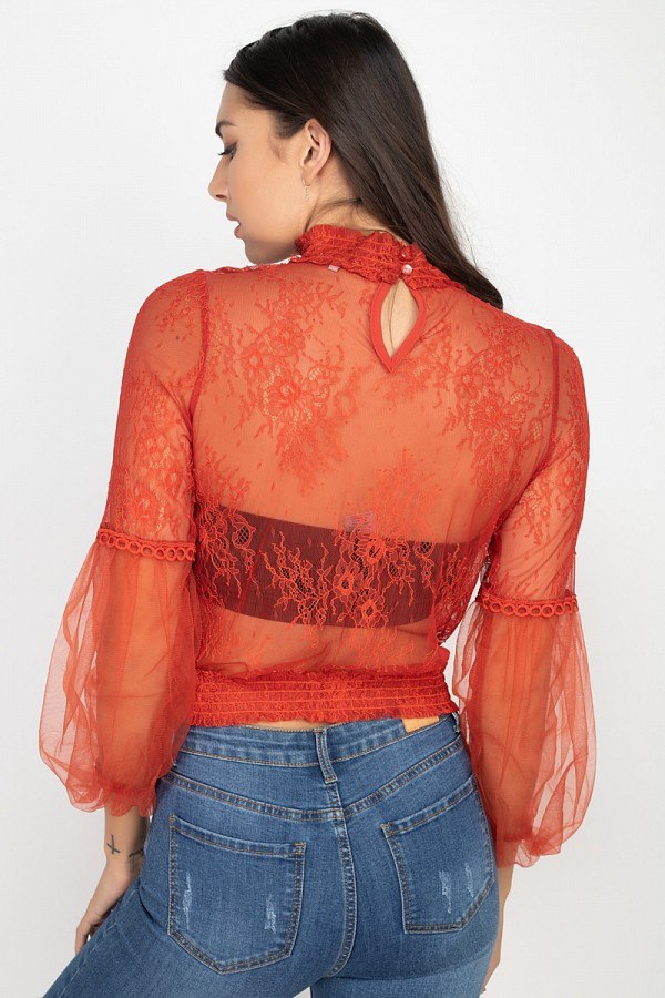 Red sheer lace smocked top, open back detail and lace-trimmed balloon cuffs