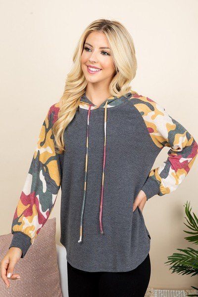 Solid French terry hoodie with charcoal body and multicolor camo sleeves, drawstring hood