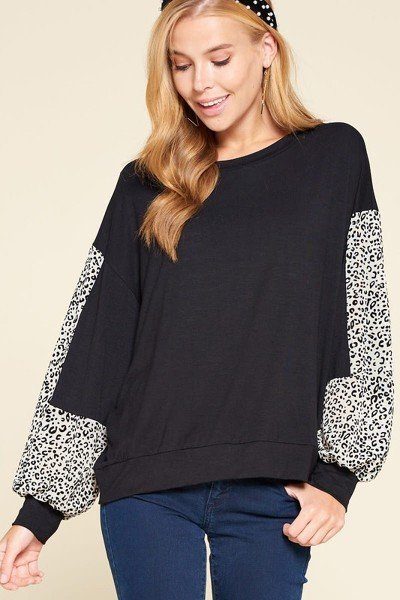 Black long-sleeve jersey top with leopard-pattern sleeves and rounded neckline