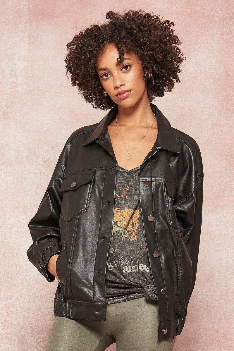 Faux leather jacket in dark tone with snap buttons and two chest pockets