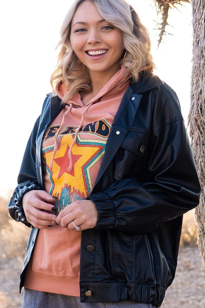 Dark faux leather jacket with snap placket, stand collar and front pockets