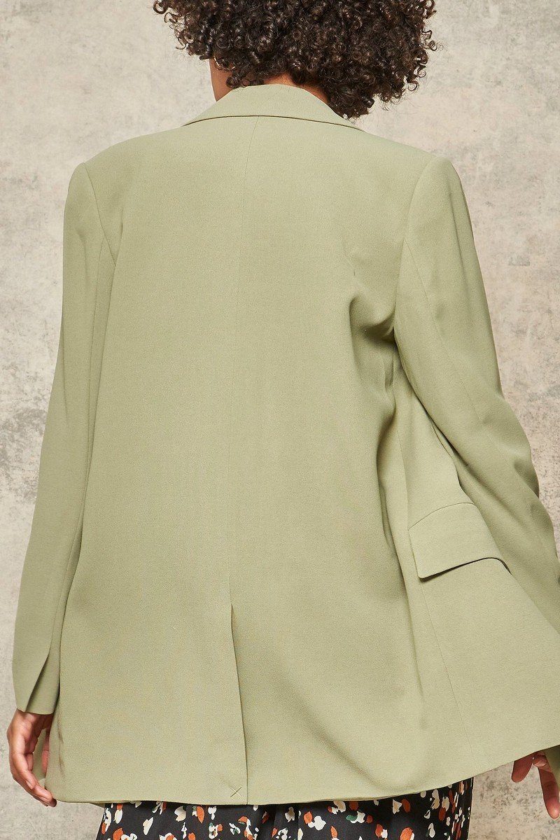 Sage solid woven blazer back view with tailored yoke and center vent
