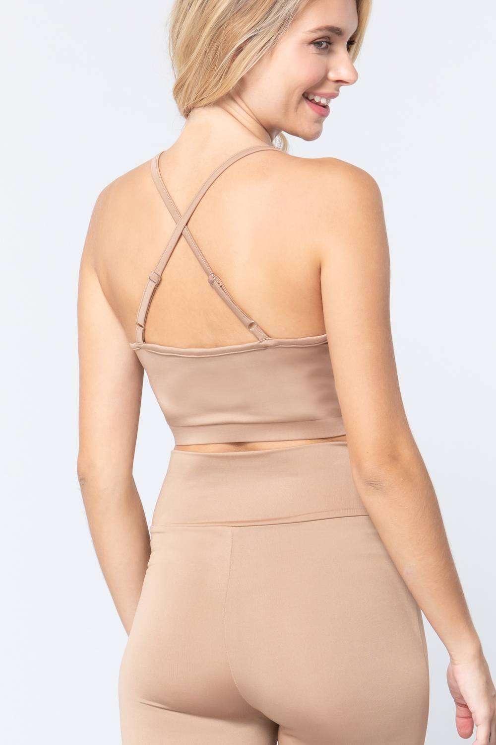 Tan workout cami bra top back view with crisscross straps and open racer back