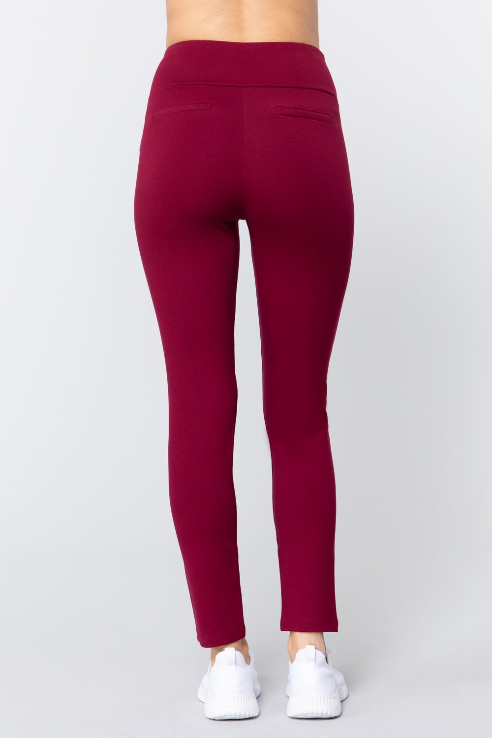Burgundy long ponte pants, back view with wide waistband and tapered leg
