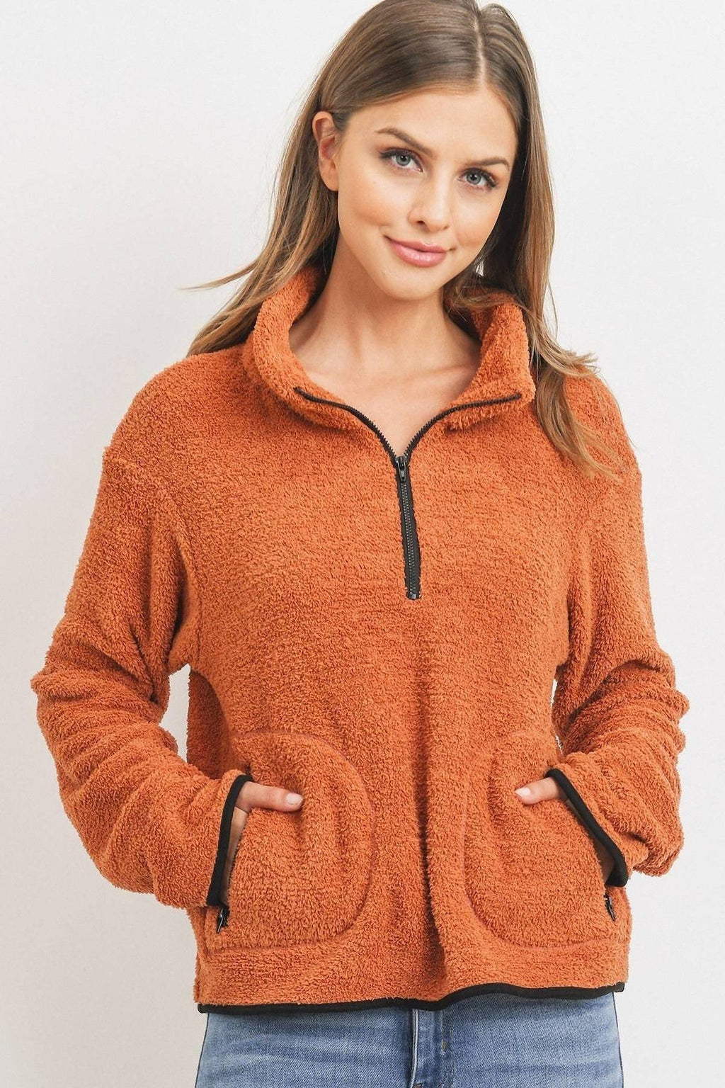 Orange looped-terry half-zip pullover with long sleeves and front kangaroo pockets