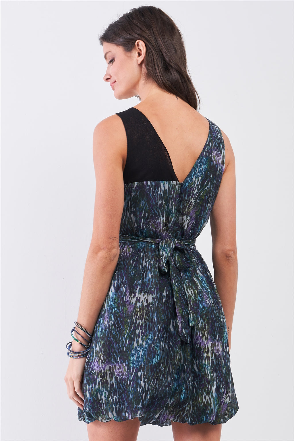 Back view mini dress: black wide straps, multicolor print, tied waist