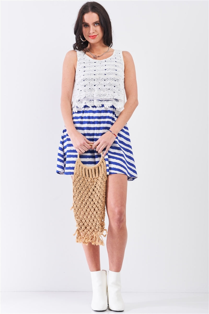 Sleeveless mini dress with white lace overlay and navy-white horizontal striped skirt