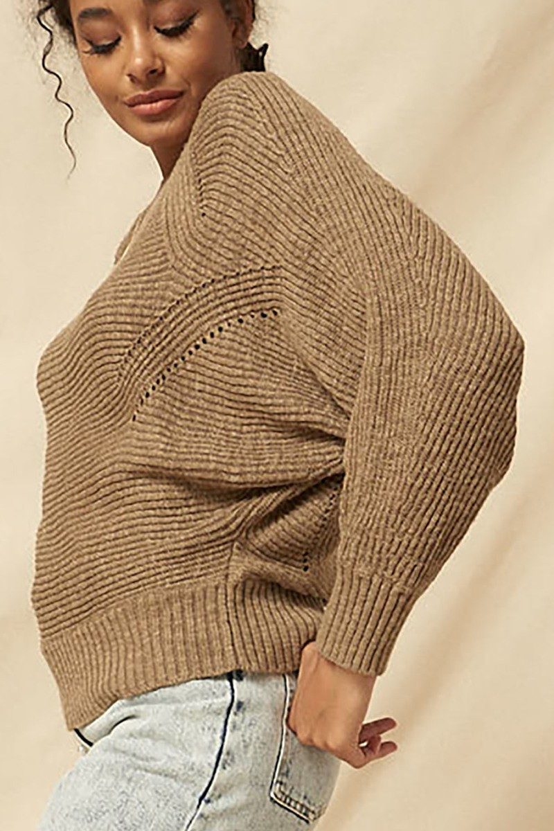 Tan ribbed knit sweater, side view with perforated dot trim at shoulder
