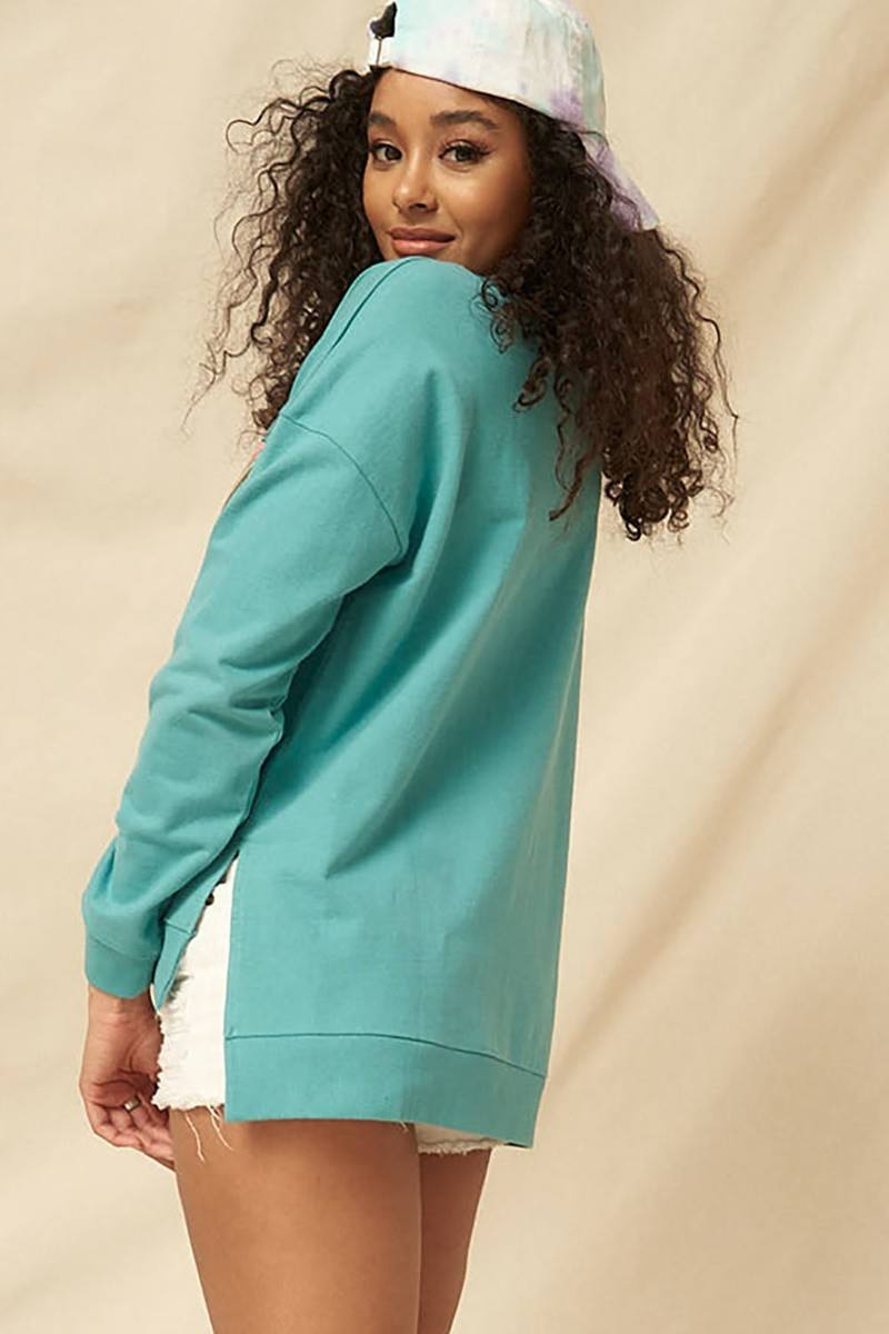 Turquoise long-sleeve mineral-washed sweatshirt, side view with raw hem