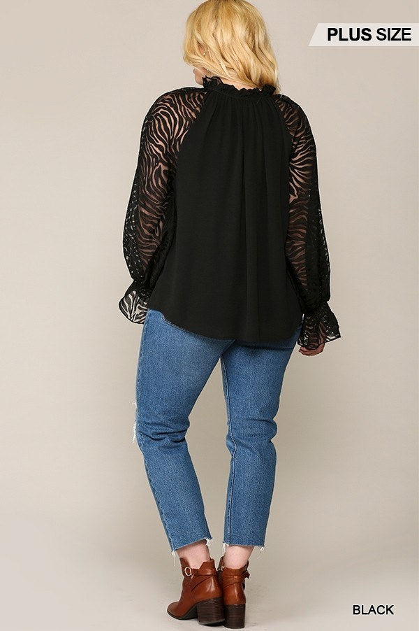 Back view of black blouse with zebra burnout long sleeves and ruffled collar