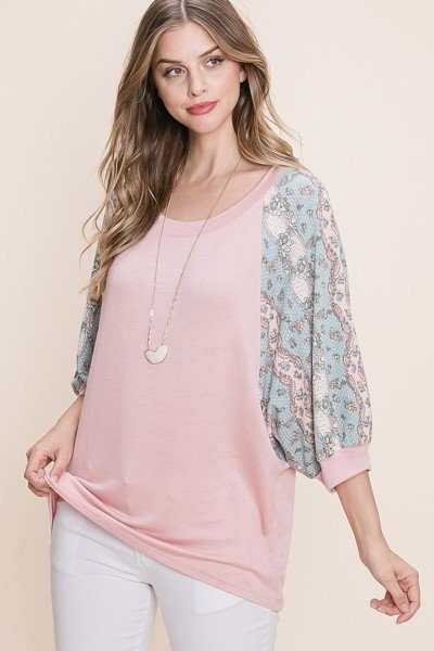 Mauve French terry fashion top with contrasting floral sleeves and draped hem
