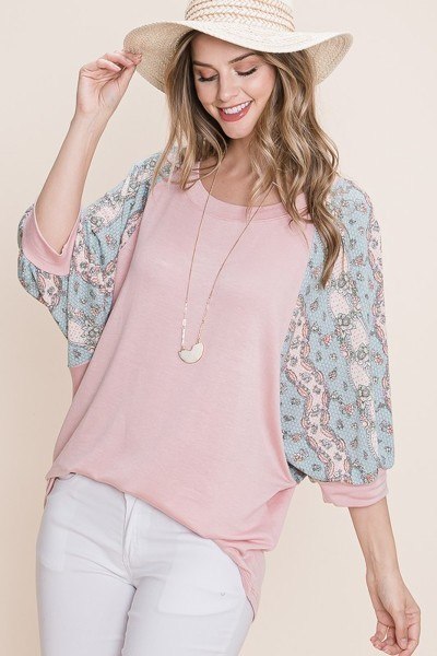 Mauve solid French terry top with floral sleeves and relaxed, casual drape