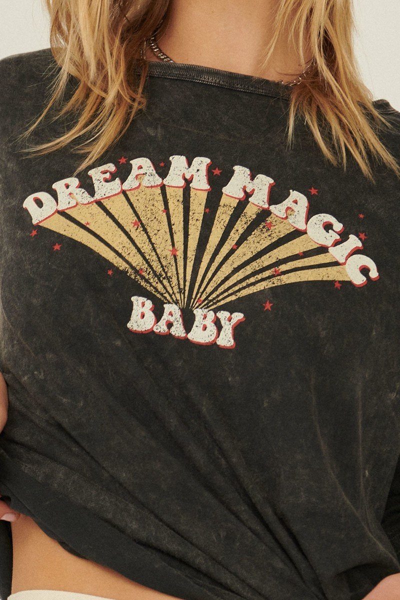 Close-up: charcoal mineral-washed knit top with “Dream Magic Baby” sunburst print