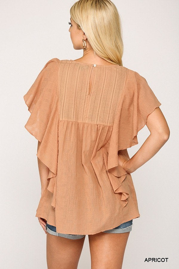 Back view: Apricot tunic top with ruffle sleeves and keyhole opening