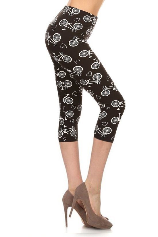 Cropped capri leggings with multi-color bike and heart print on dark base