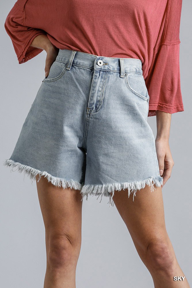 High rise light-wash denim shorts with raw frayed hem at the cuffs