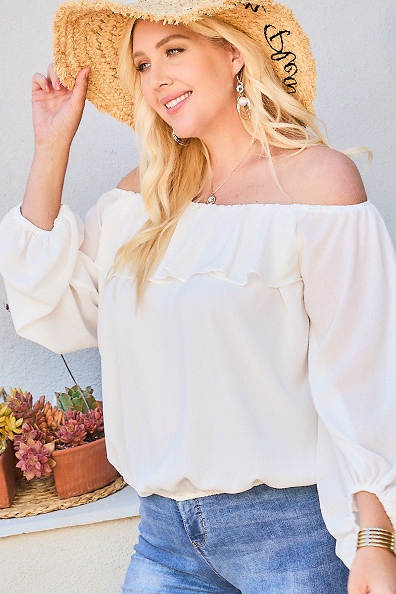 White off-shoulder ruffle blouse with long voluminous sleeves