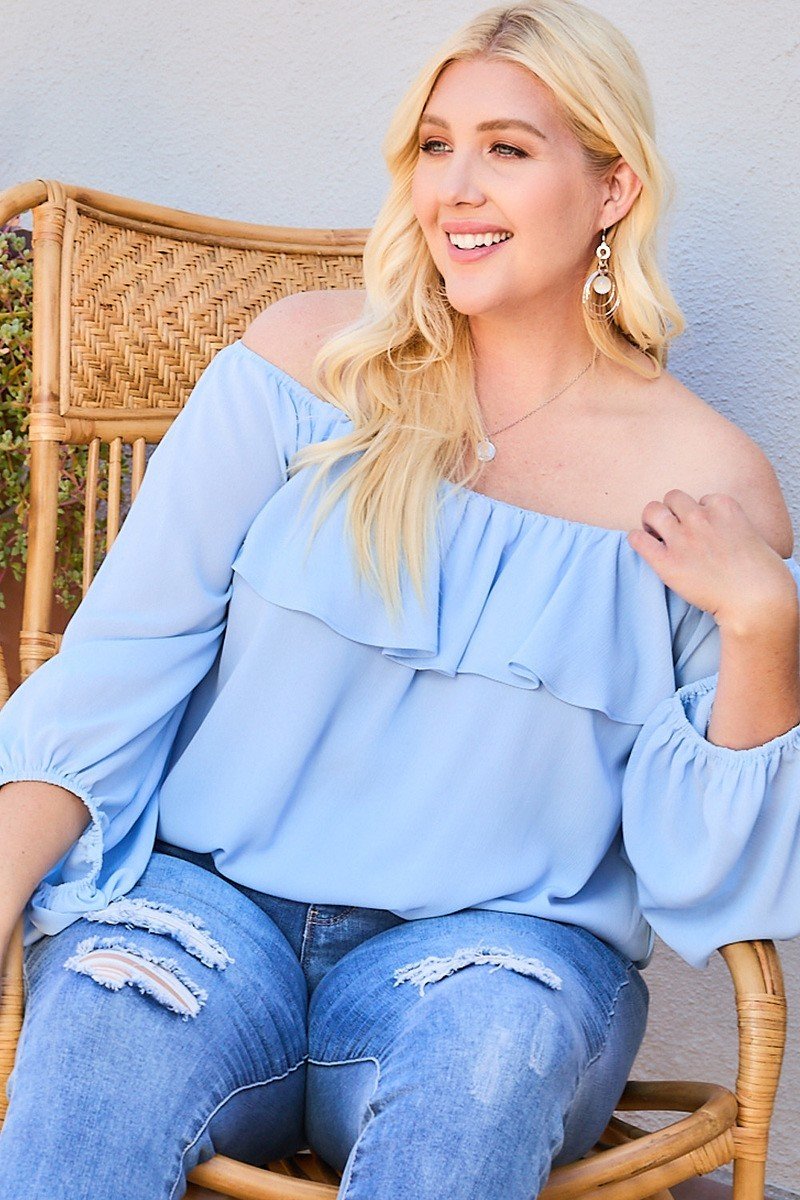 Dusty blue off-shoulder ruffle blouse with gathered sleeve cuffs