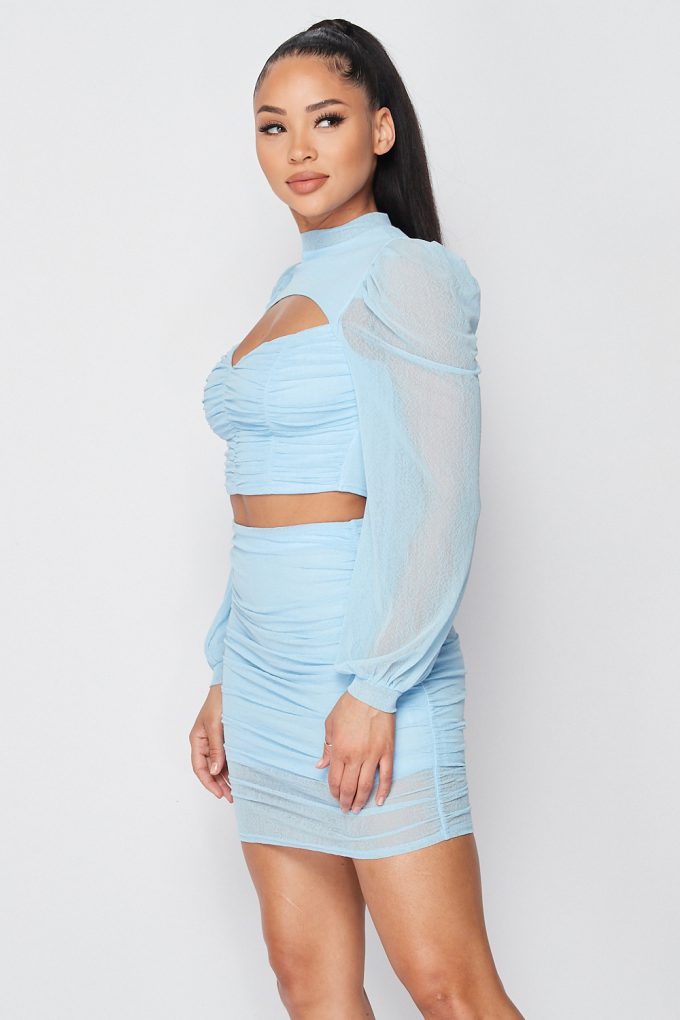 Light blue cutout crop top and ruched mini skirt with sheer long sleeves
