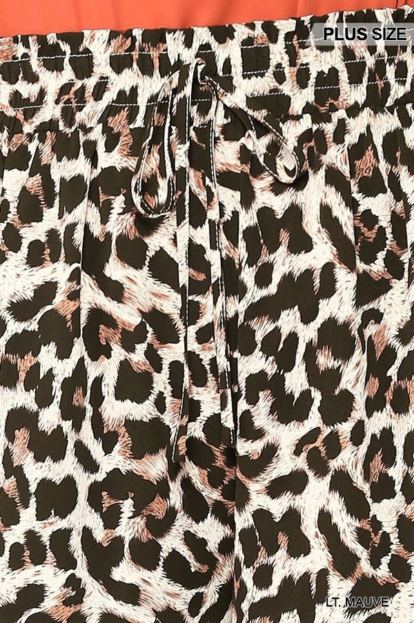 Leopard print fabric close-up with waist tie detail on side-pocket shorts