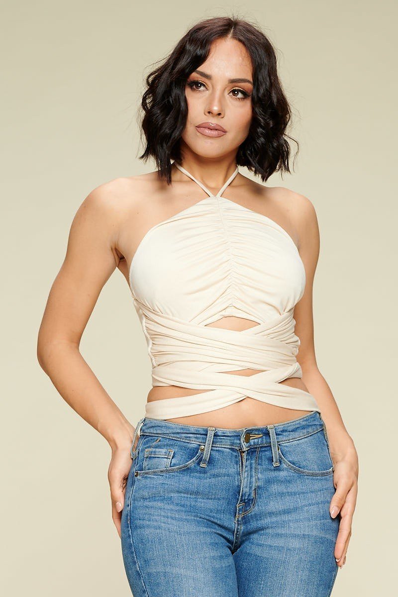 Cream crop halter top with ruched cross straps and center cutout
