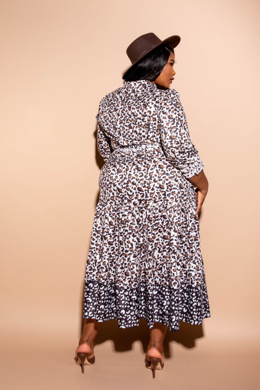 Leopard print shirt dress from back view with tiered skirt and belted waist