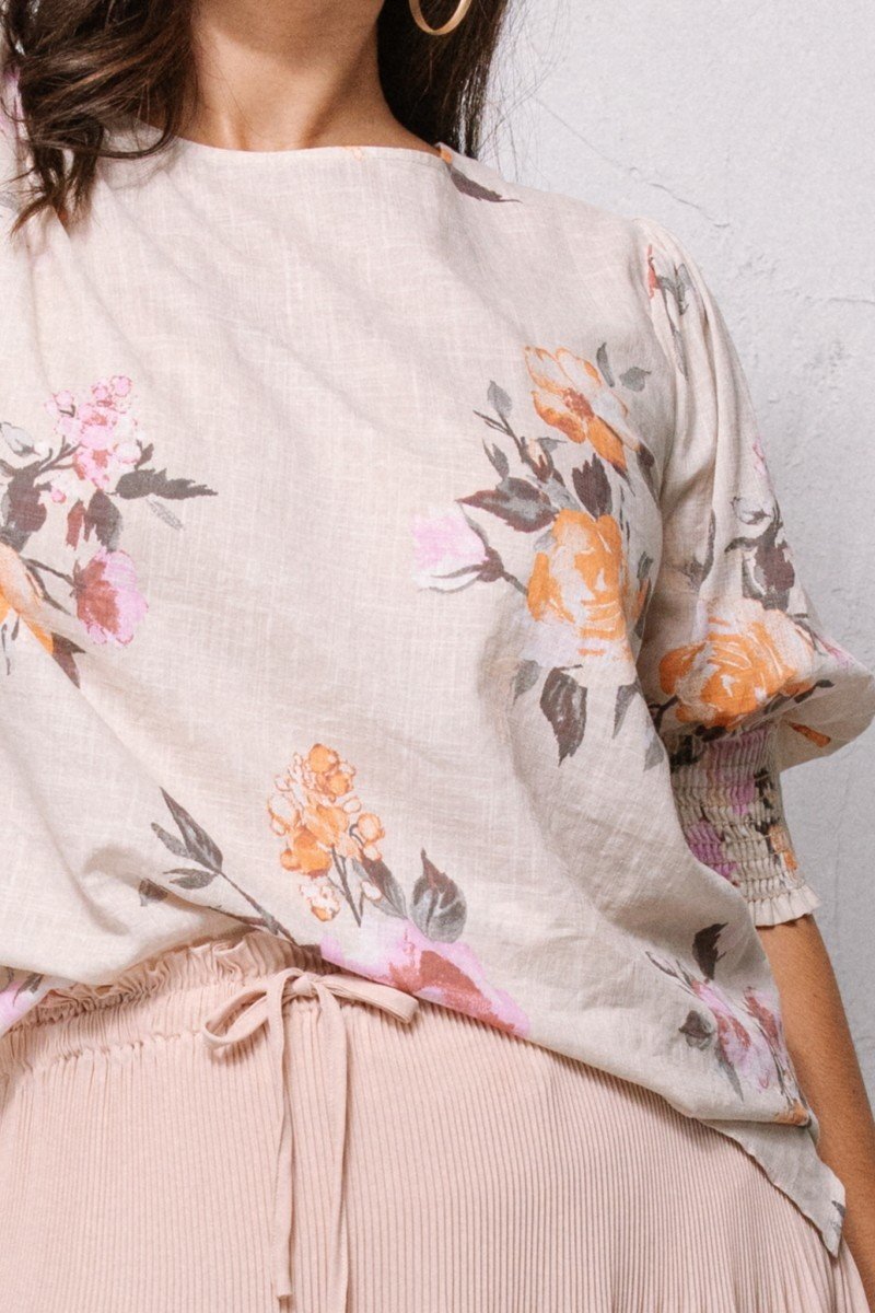 Oatmeal floral blouse detail: puff sleeves and tie waist
