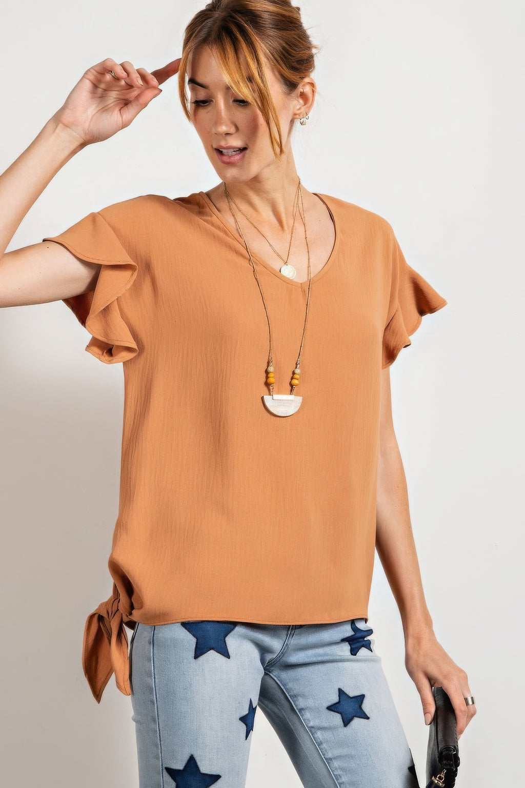 V-neck woven top with wing sleeves, rust color