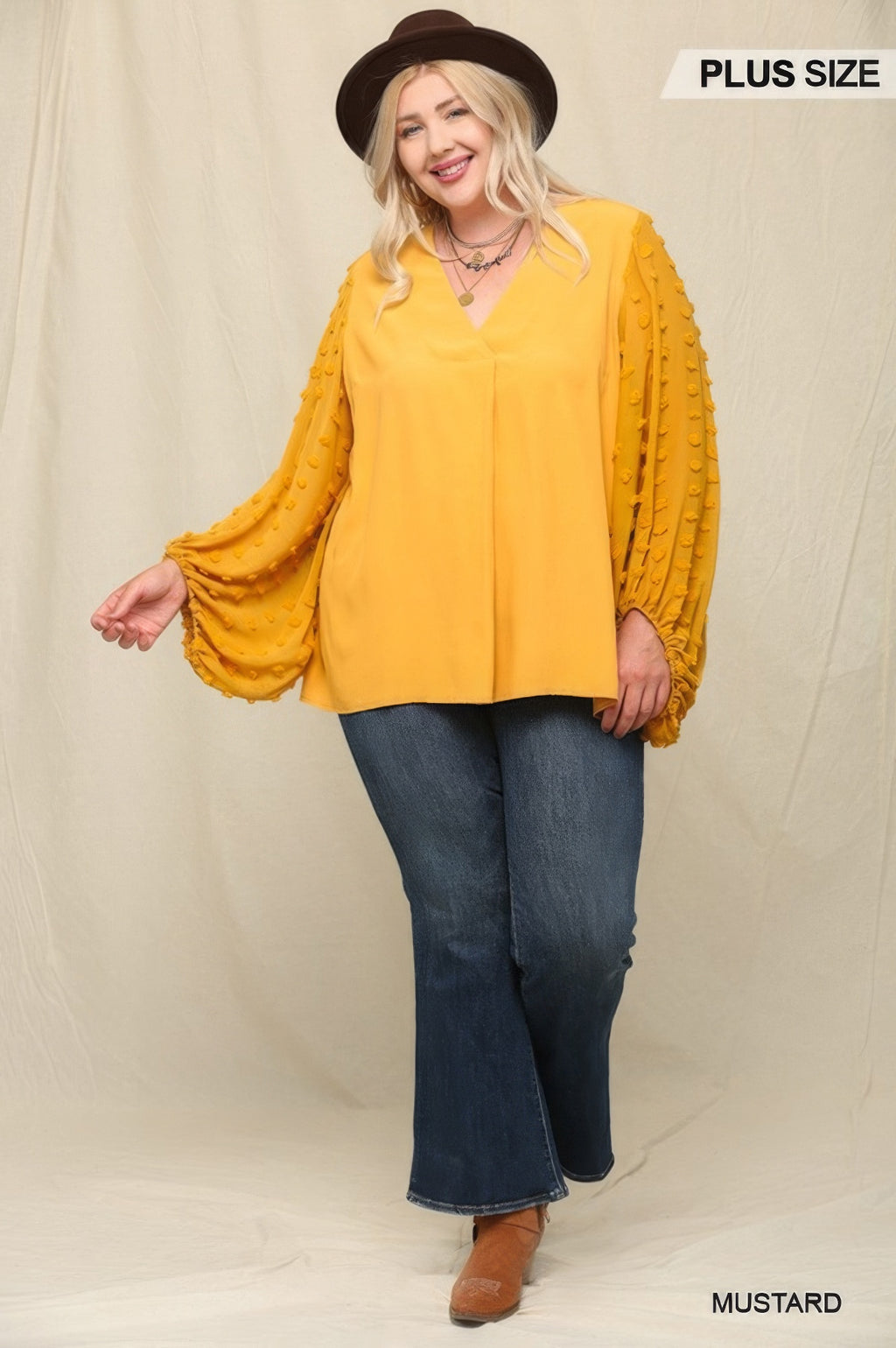 Mustard blouse with textured sheer sleeves and relaxed V-neck