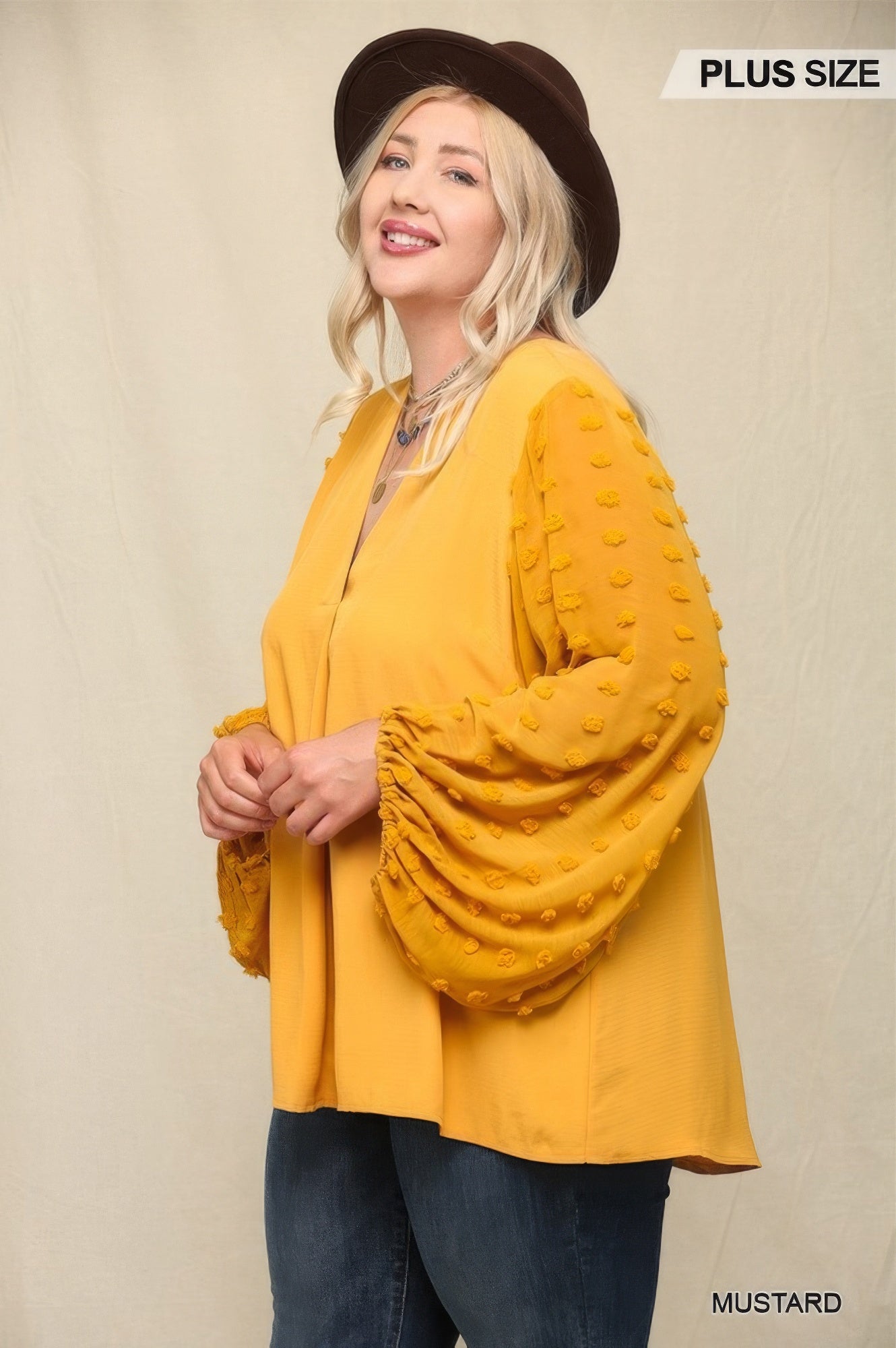 Mustard chiffon top with billowy sheer sleeves and V-neck