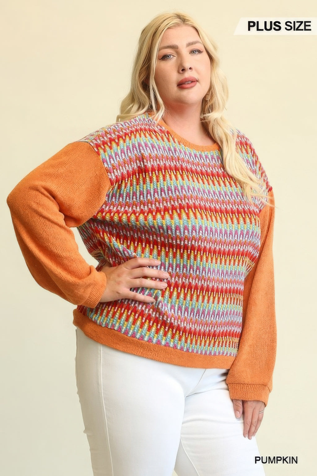 Pumpkin knit top detail: rainbow stripe body with orange solid sleeves and wide neckline