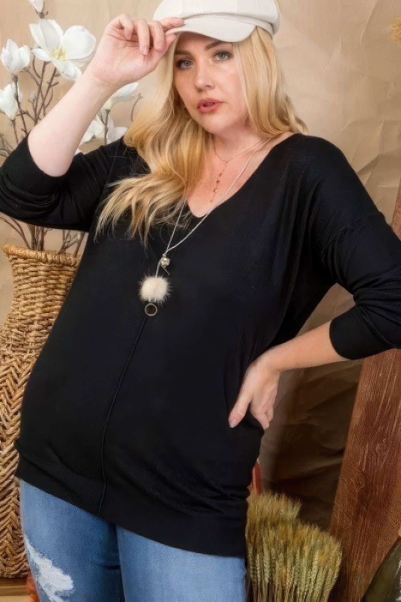 Black V-neck 3/4 sleeve sweater with hi-lo hem and side slit, relaxed fit
