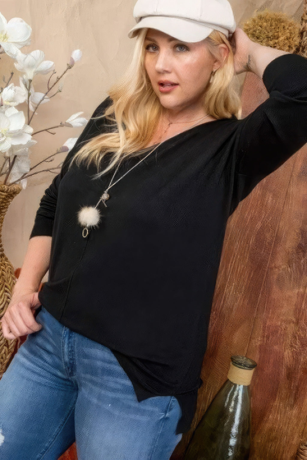 Black plus size V-neck sweater with 3/4 sleeves and subtle side slit