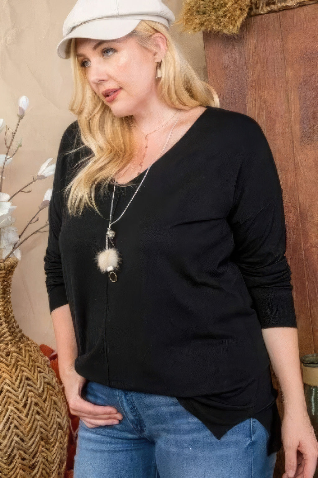 Black V-neck 3/4 sleeve hi-lo sweater with side slit and pocketed look