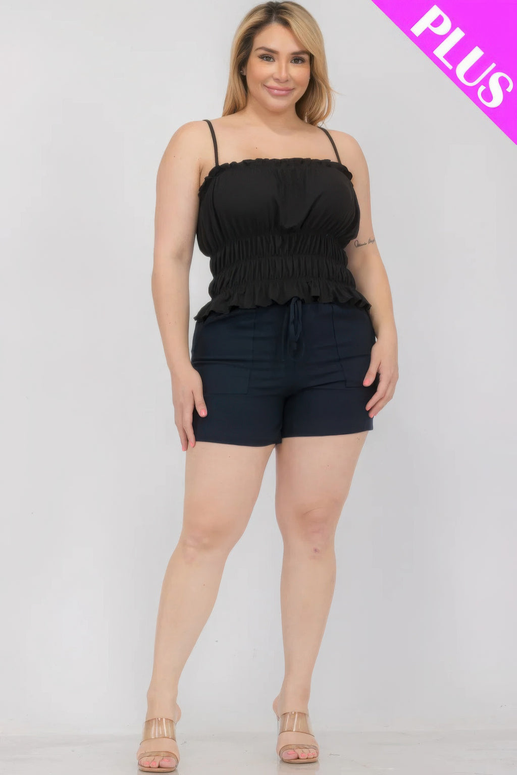 Black tiered shirred body crop top, smocked bust and layered peplum hem, spaghetti straps