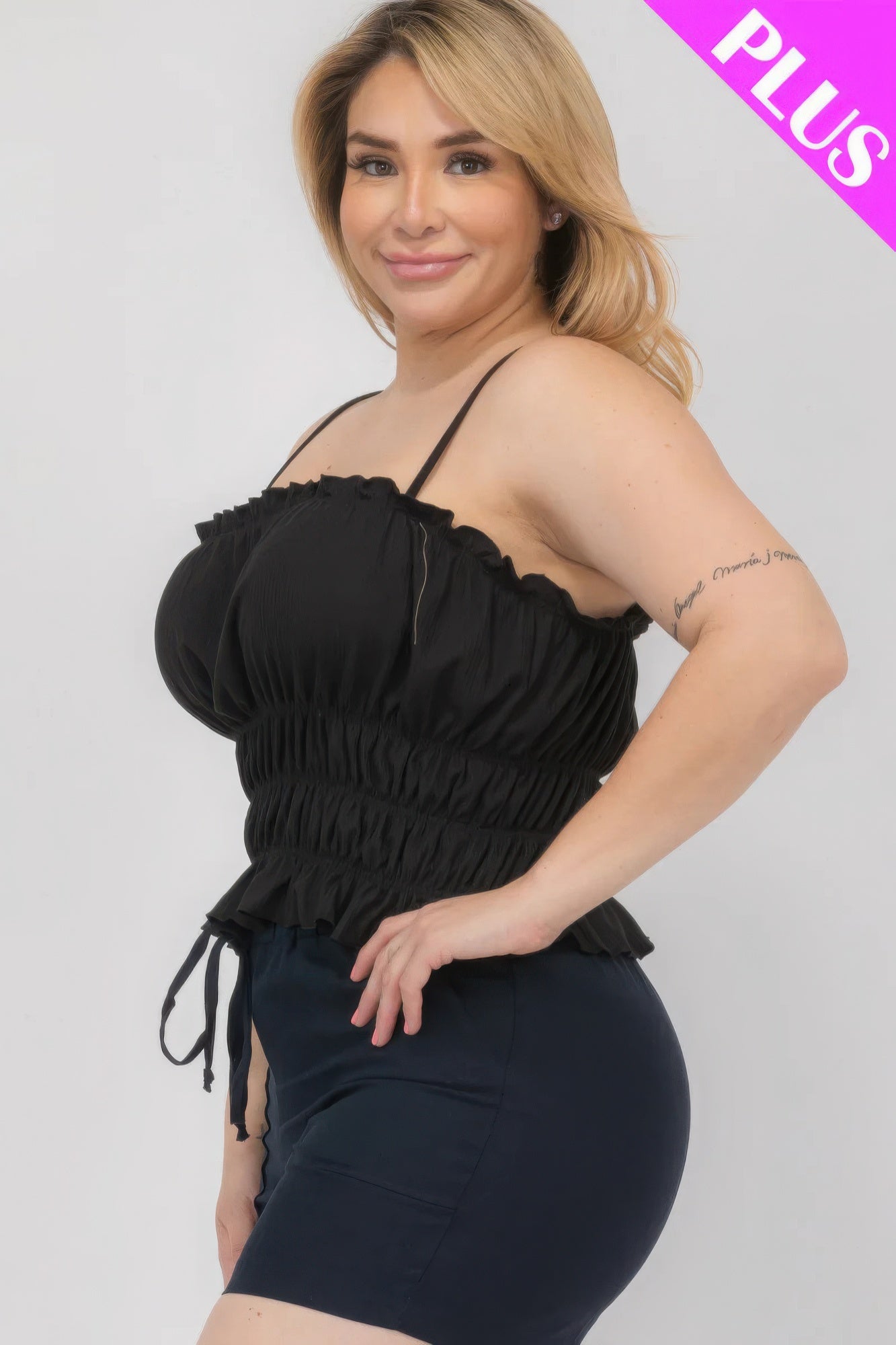 Black tiered shirred body crop top with ruched bandeau fit and layered ruffle tiers
