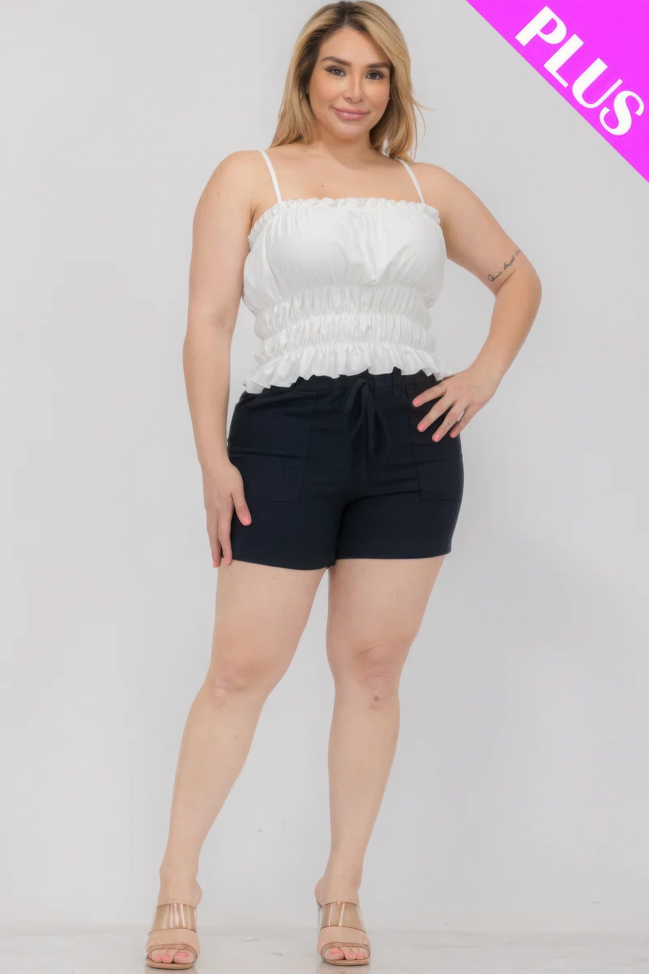 White tiered shirred body crop top, straight neckline, spaghetti straps