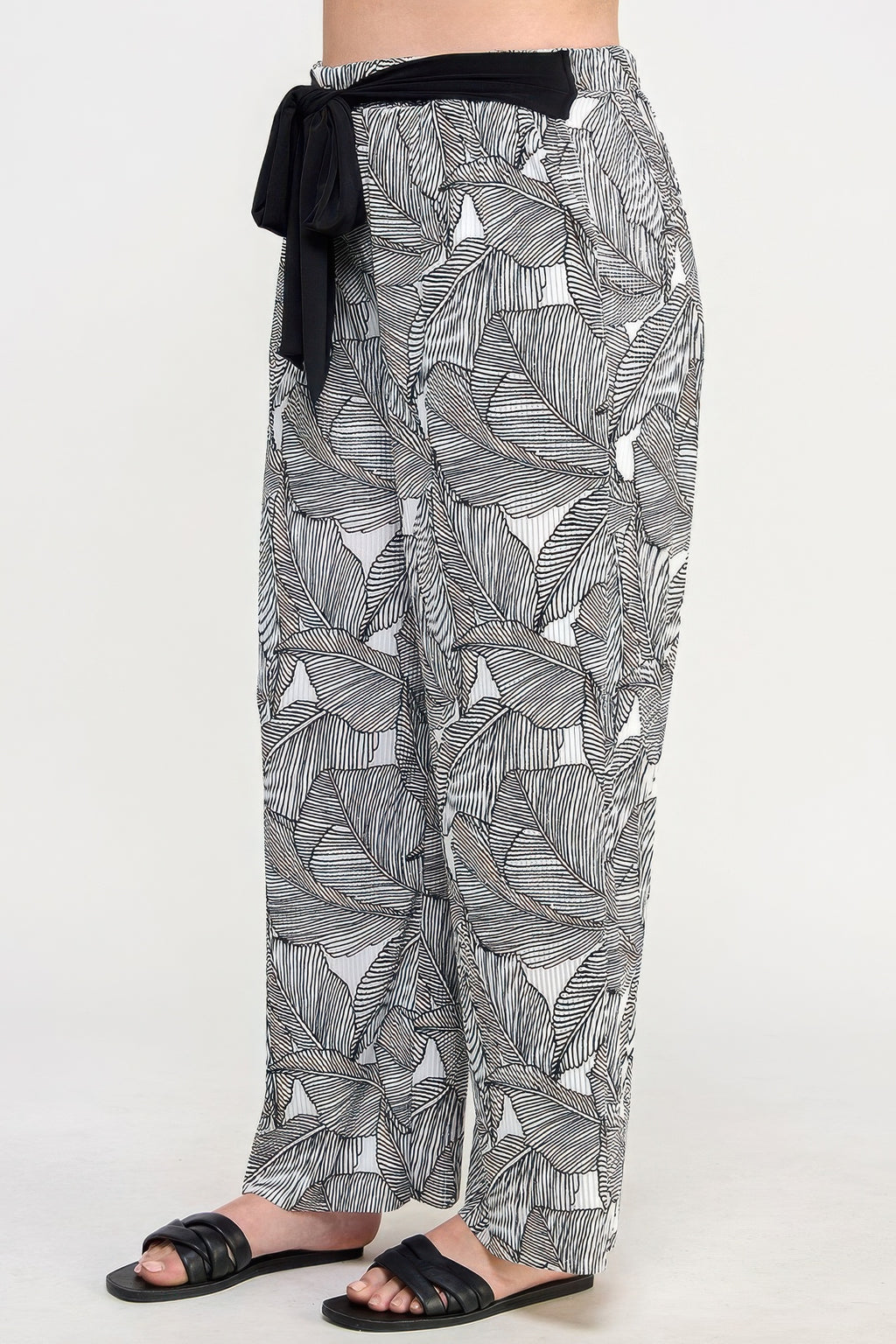 Plisse palm print pants (back view), black tie at elastic waist, relaxed wide legs