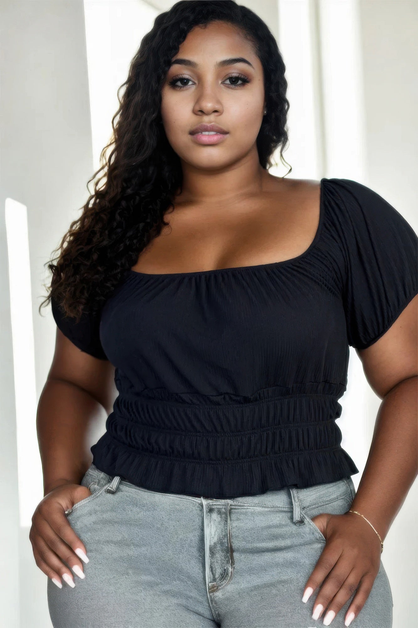 Black ribbed knit top with ruched waist and puff sleeves, solid color