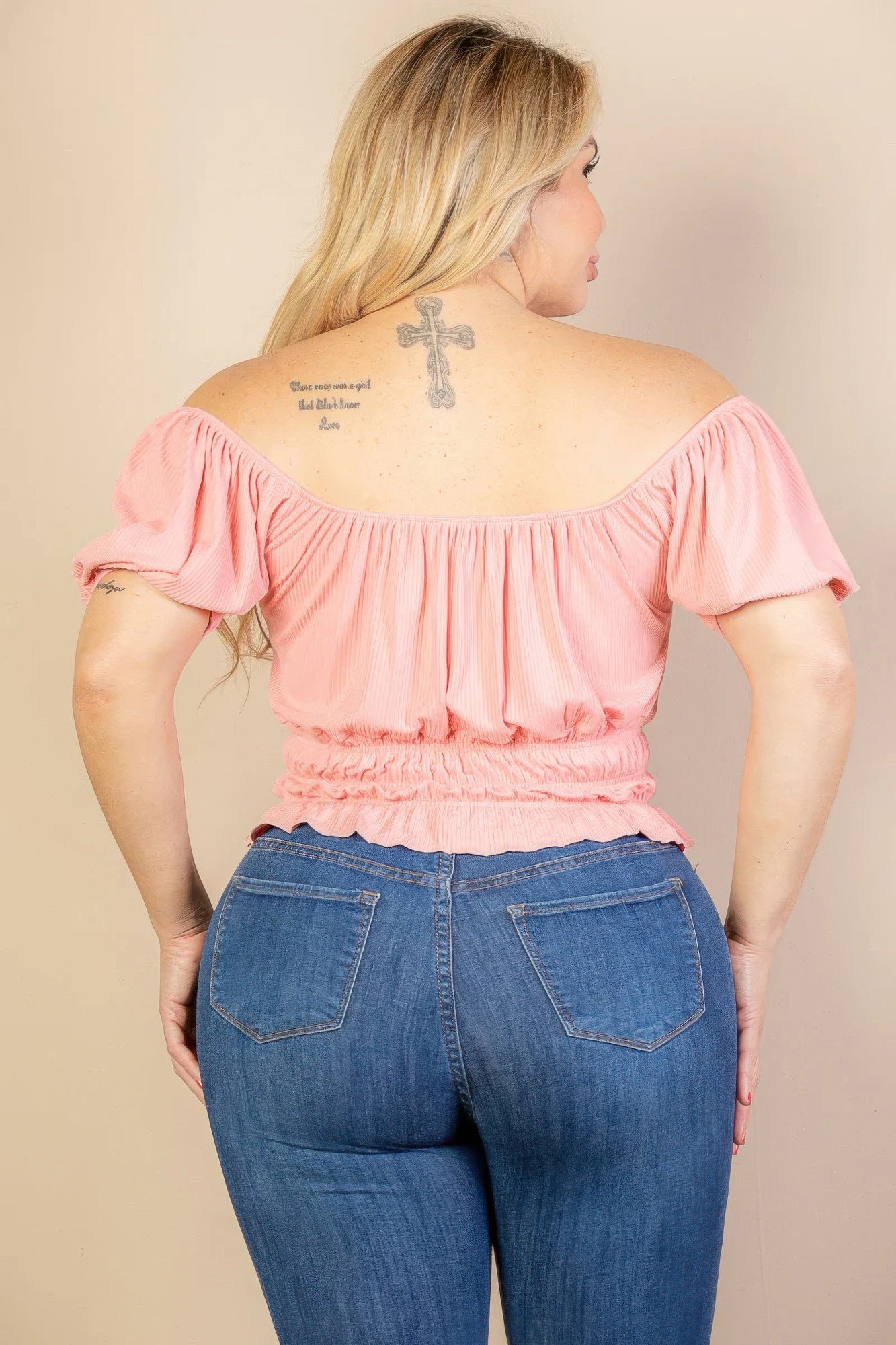 Blush back view: ruched knit top with puff sleeves and gathered neckline