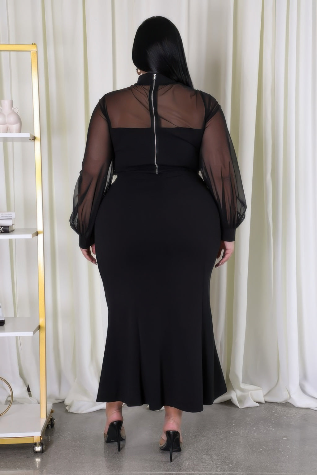 Black stretch skirt set back view: sheer long sleeves over fitted long skirt
