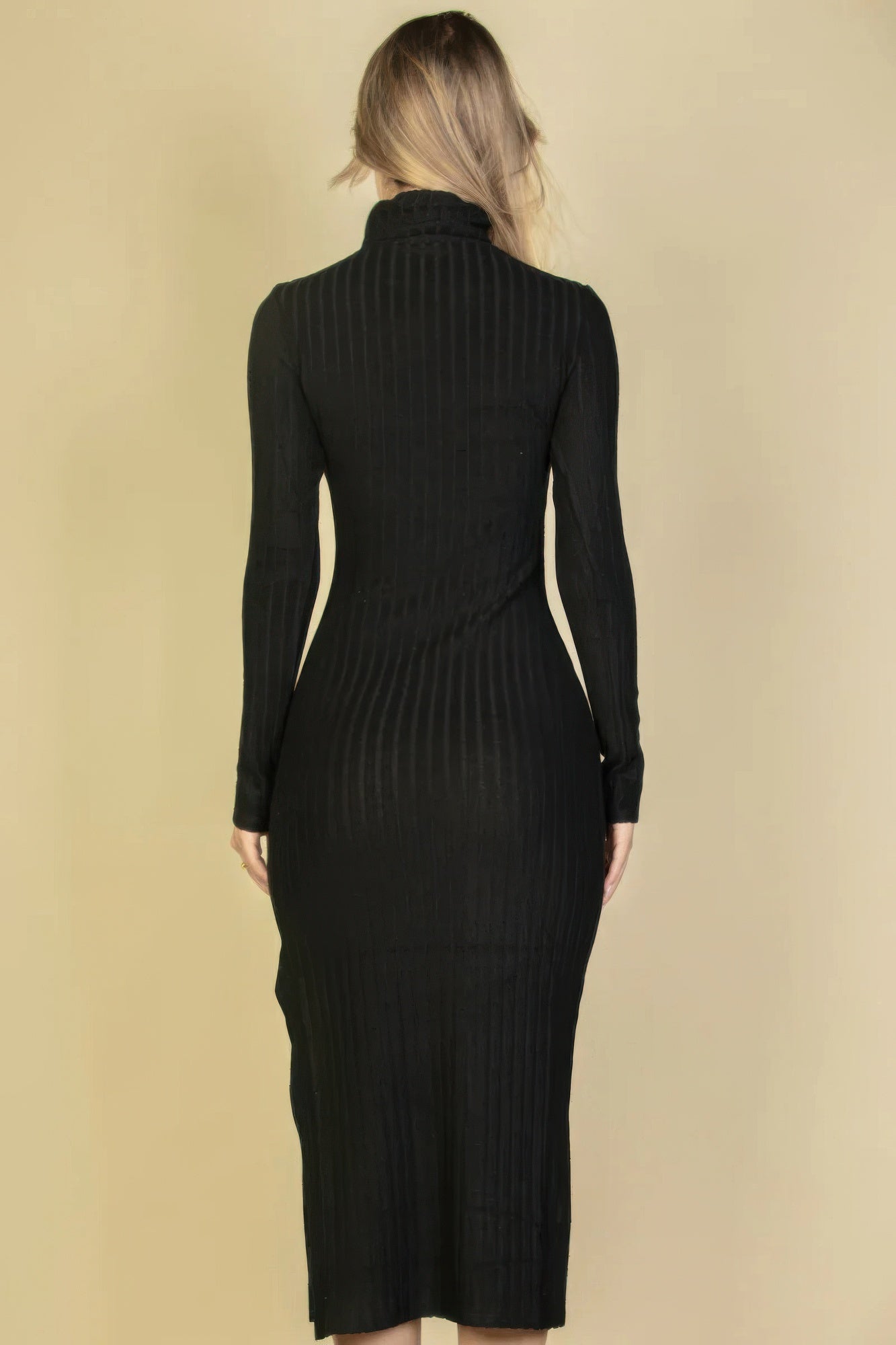 Black fuzzy knit turtleneck midi dress, back view with long sleeves and slit