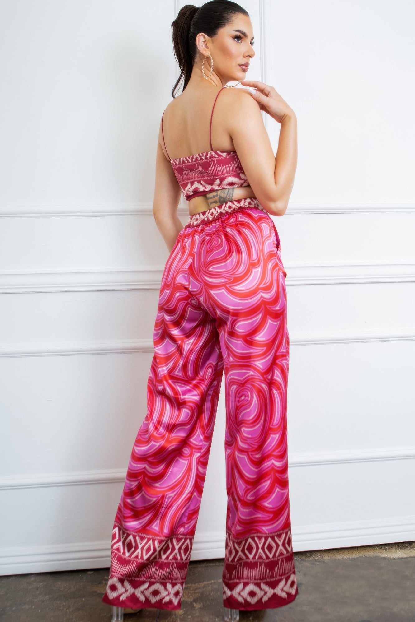 Pink printed wide-leg pants with back of bra top and long straps, matching set
