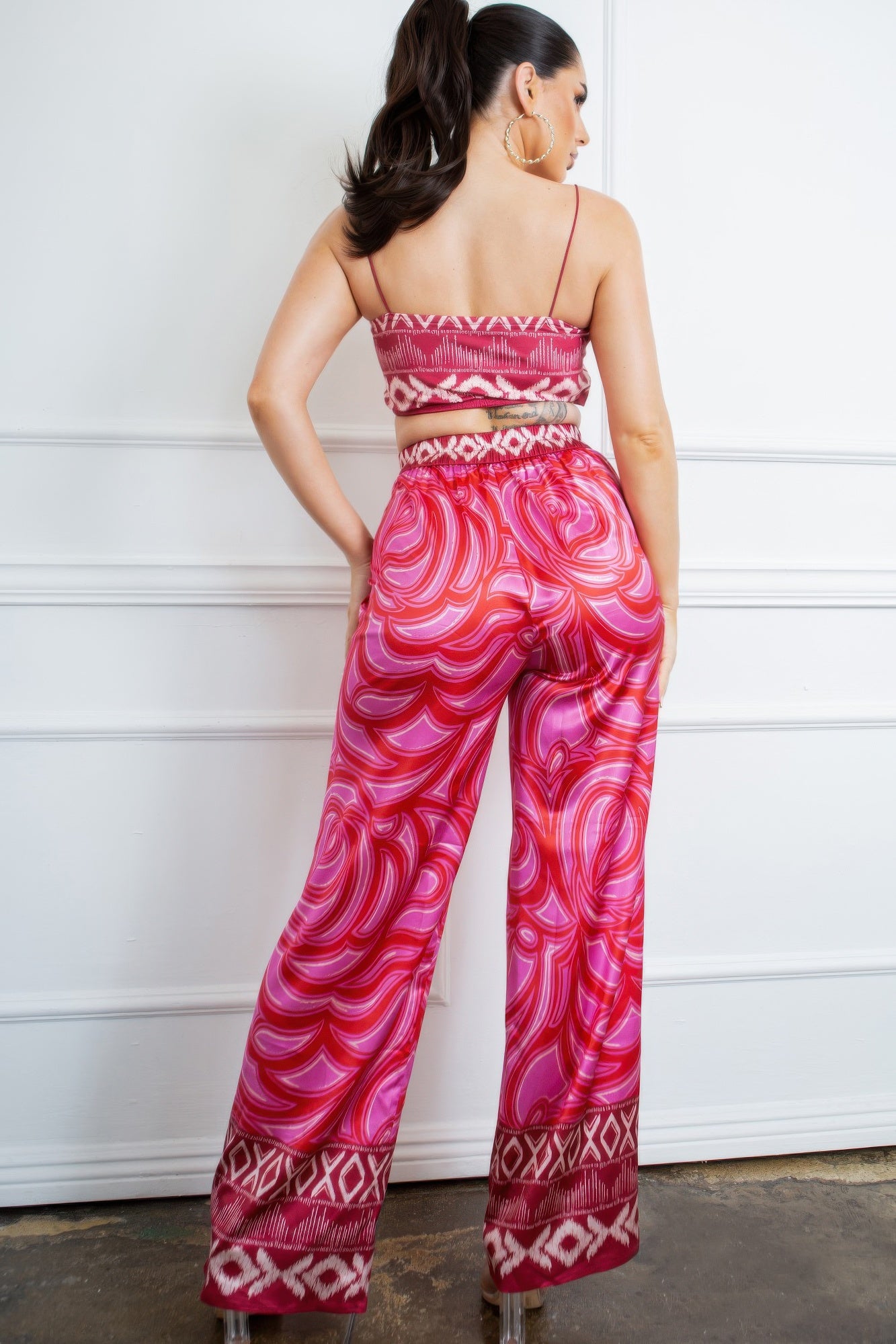 Pink printed bra top and wide-leg pants set, back view with border at hem