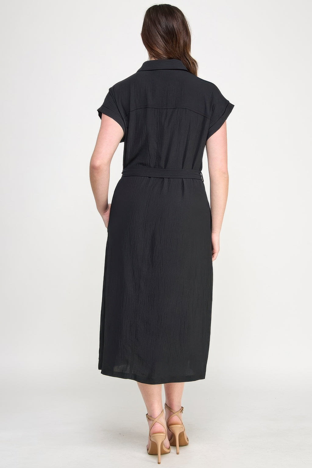 Back view: black short-sleeve button dress with waist tie and gathered yoke