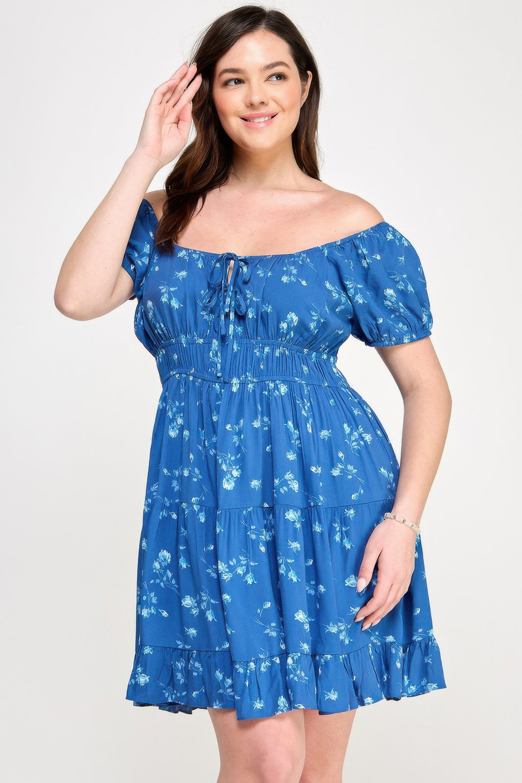Blue floral mini dress with elastic waist, puff sleeves, and front tie neckline
