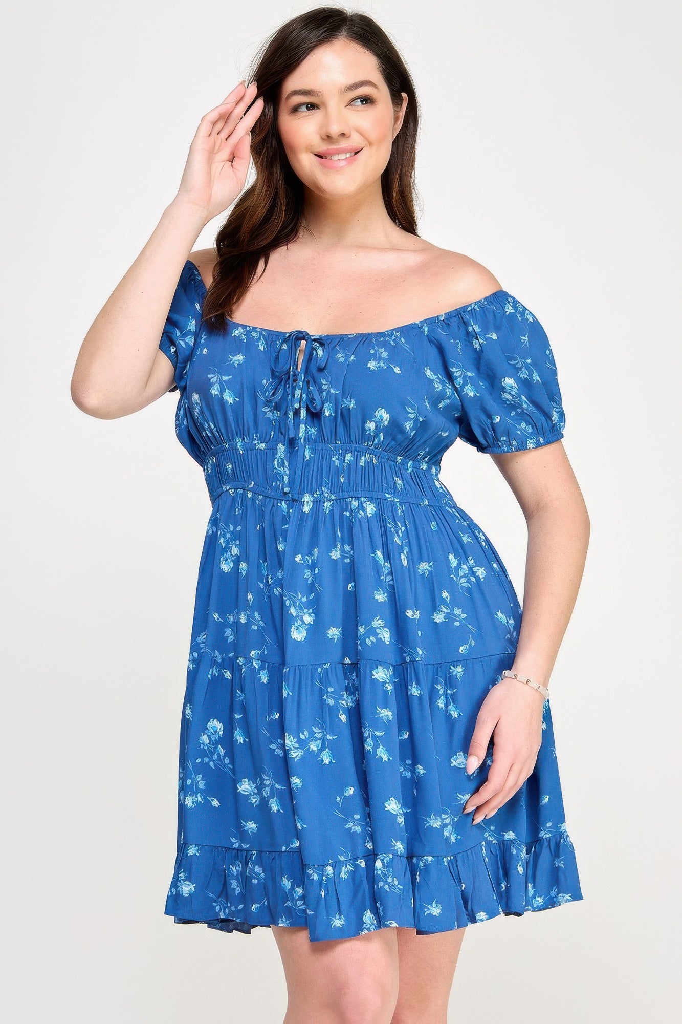 Blue floral mini dress with elastic waist, puff sleeves, and front tie neckline