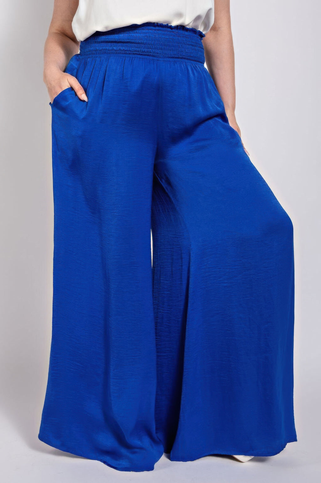 Washed satin wide pants in royal blue with smocked waist and flowing wide legs
