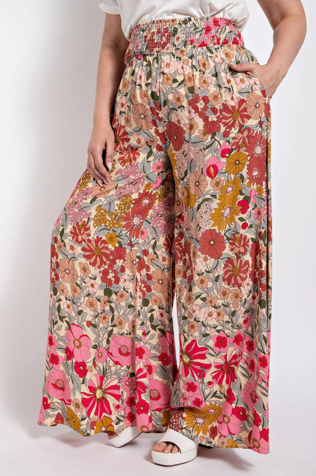 Floral wide-leg pants with smocked waist and side pocket, flowing drape
