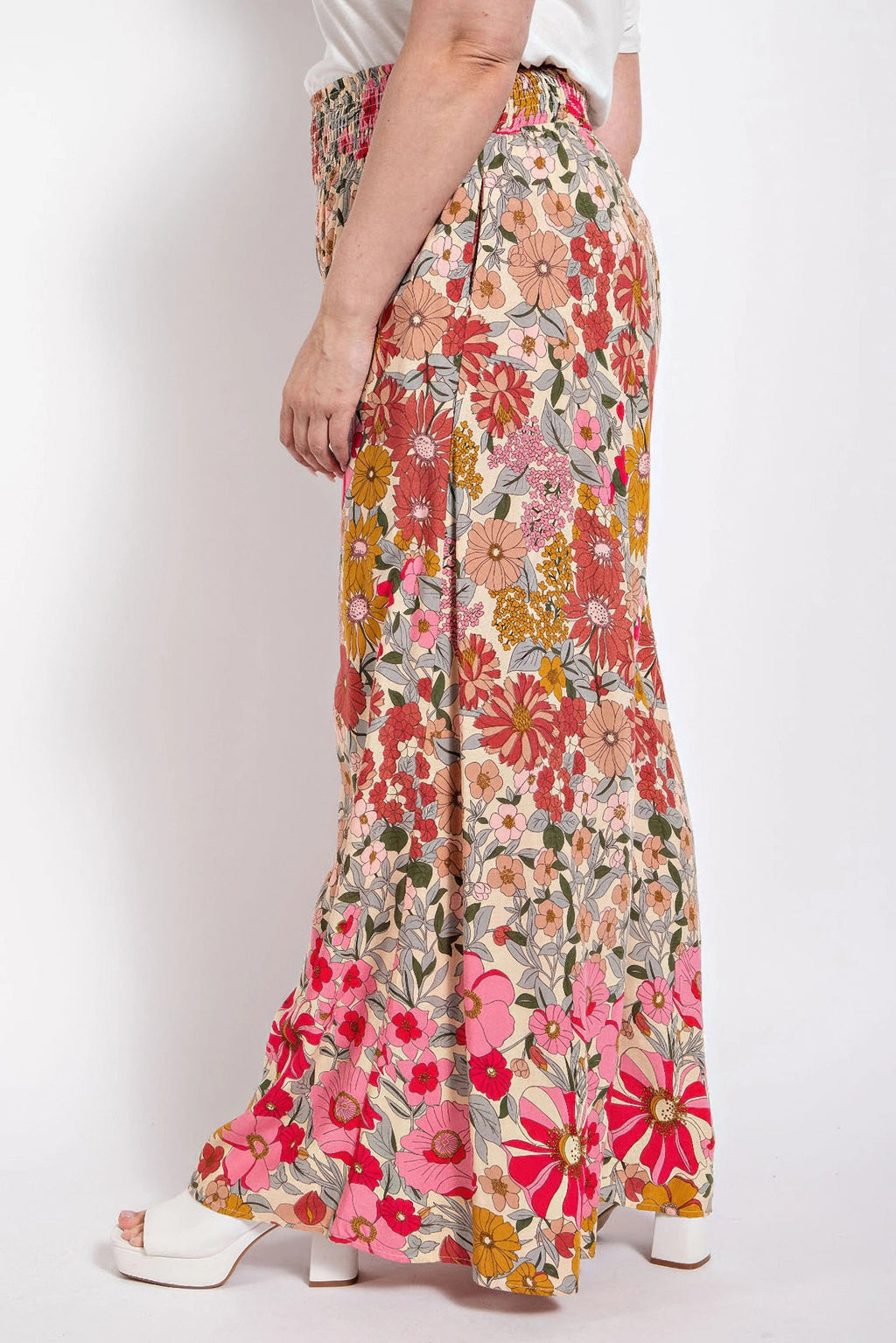 Multicolor floral flare pants with elastic smocked waist and side pockets